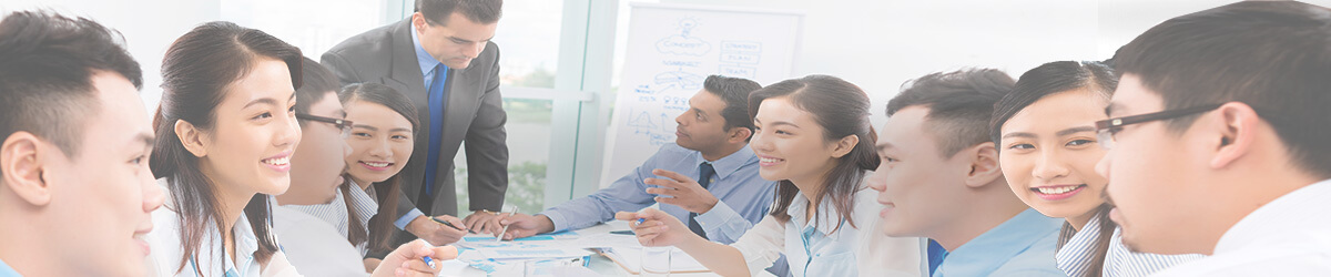 a group of people wearing office attire engaging in discussion in a meeting